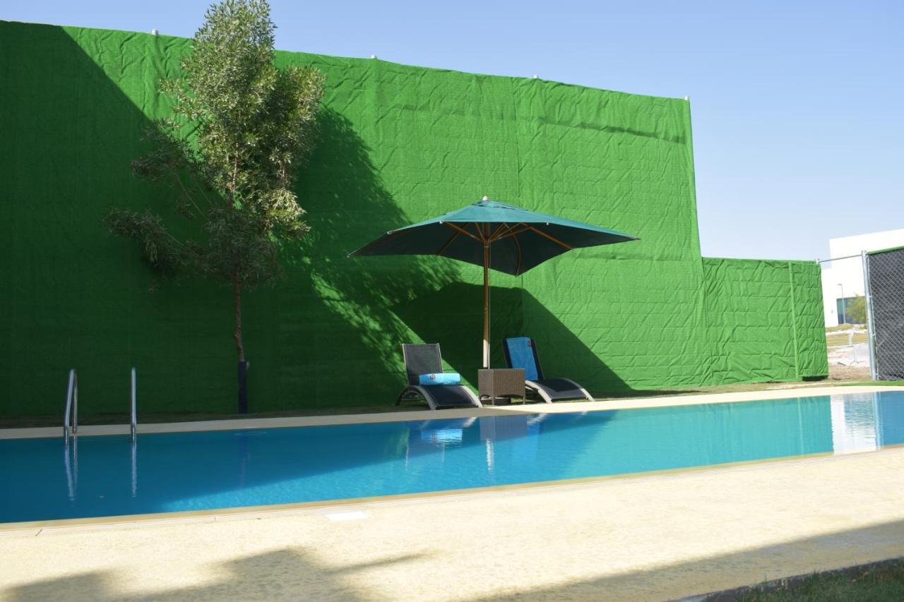 Retaj Salwa Resort & Spa Al Rayyan Exterior foto A swimming pool in Spain